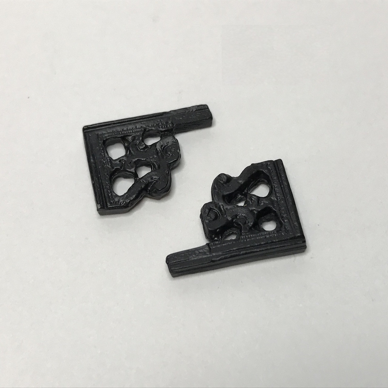 Miniature black brackets