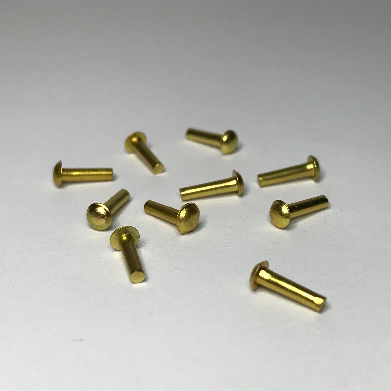 Package of 10 medium-size brass knobs for dollhouse miniature use