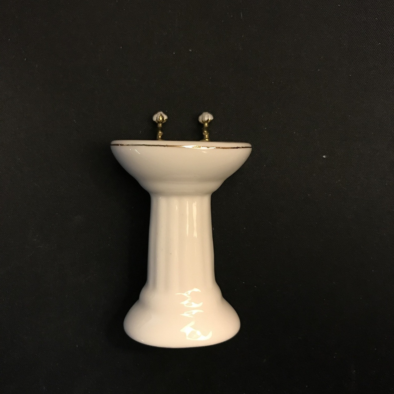 White dollhouse bathroom sink with gold rim basin