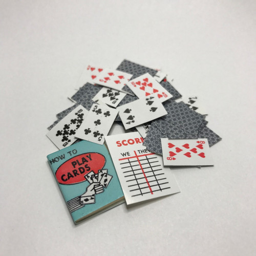 Miniature deck of playing cards with rule book and score sheet