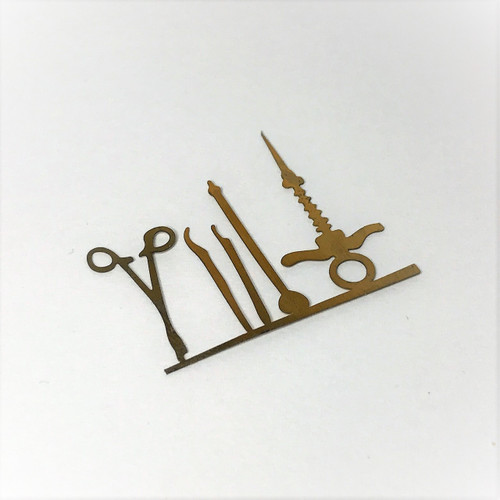 Dental tool set.  Brass pieces are easily removed from frame.  