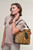 mdel holding Leopard Print Leather Handbag TH337