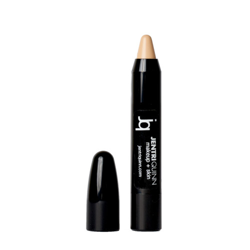 Matte beige brow highlighter pencil being used to lift and define the brow bone.