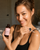 Applying body oil for dry, mature skin.