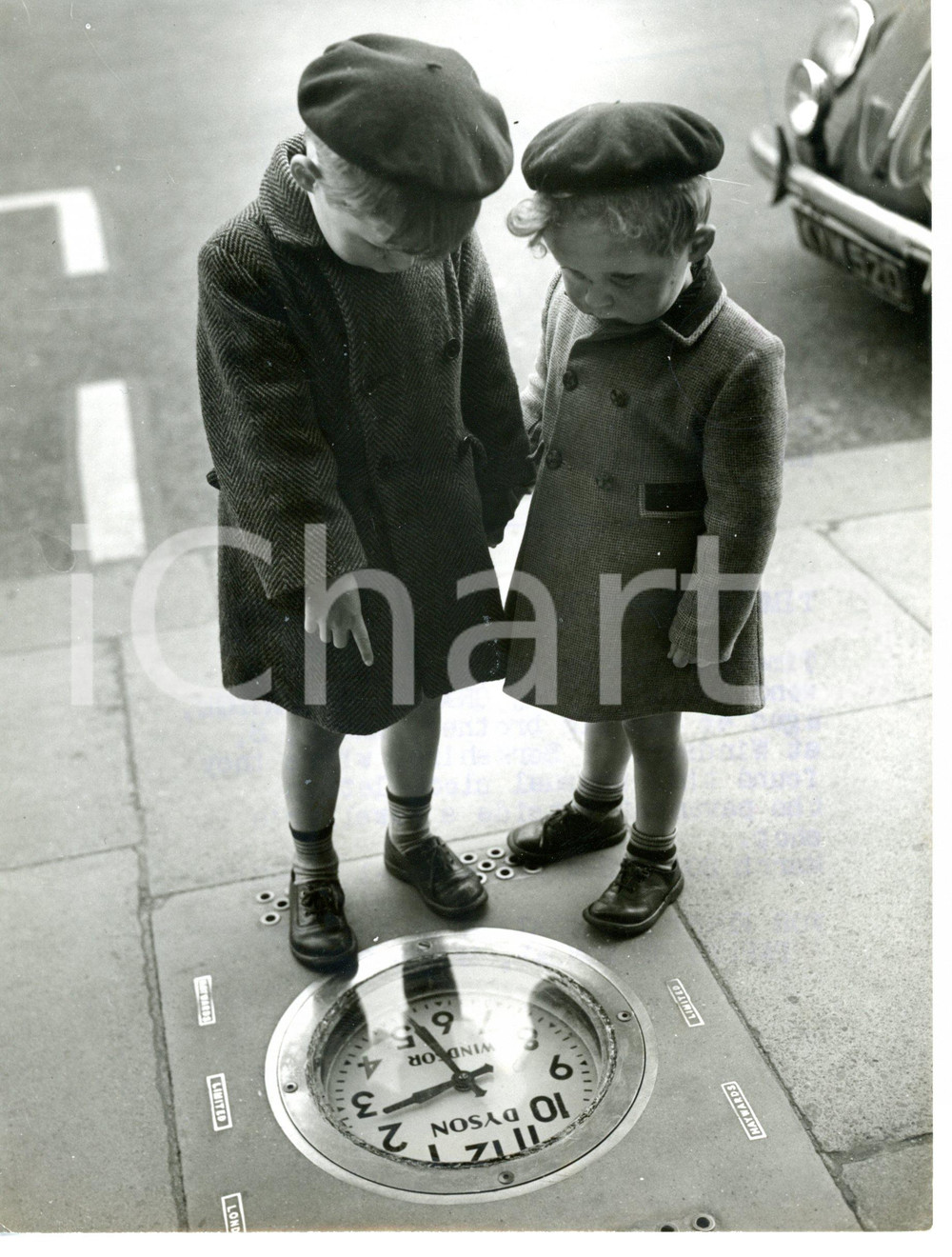 1954 WINDSOR Graham and David WOOLRIDGE admiring a clock in the floor *Photo