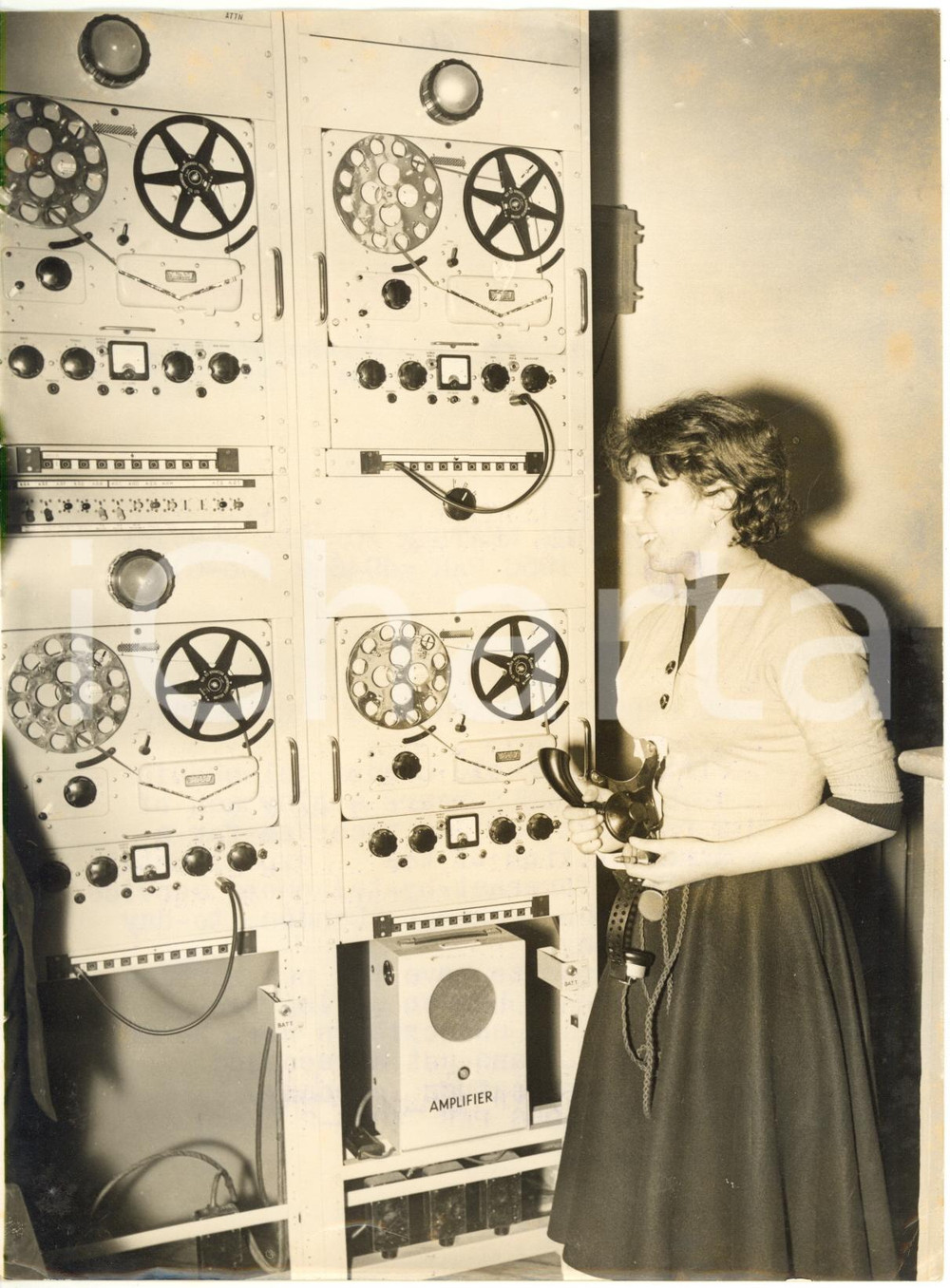 1956 LONDON - Young telephonist tries new weather forecast-by-telephone service