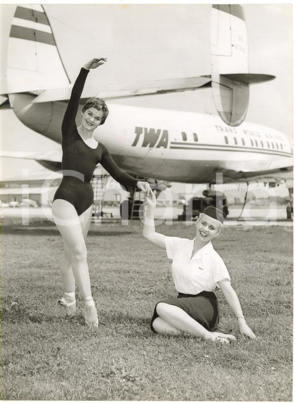 1958 LONDON TWA hostesses Marianne BURT and Joan WILLIAMS dancing at the airport