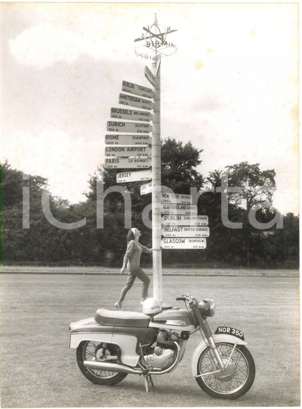 1960 BIRMINGHAM AIRPORT - New NORTON NAVIGATOR at the international signpost