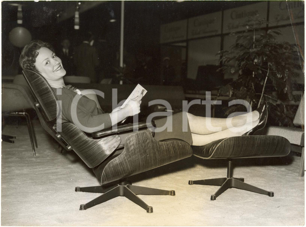 1959 LONDON EARLS COURT Furniture Exhibition - A woman relaxes on an esay chair