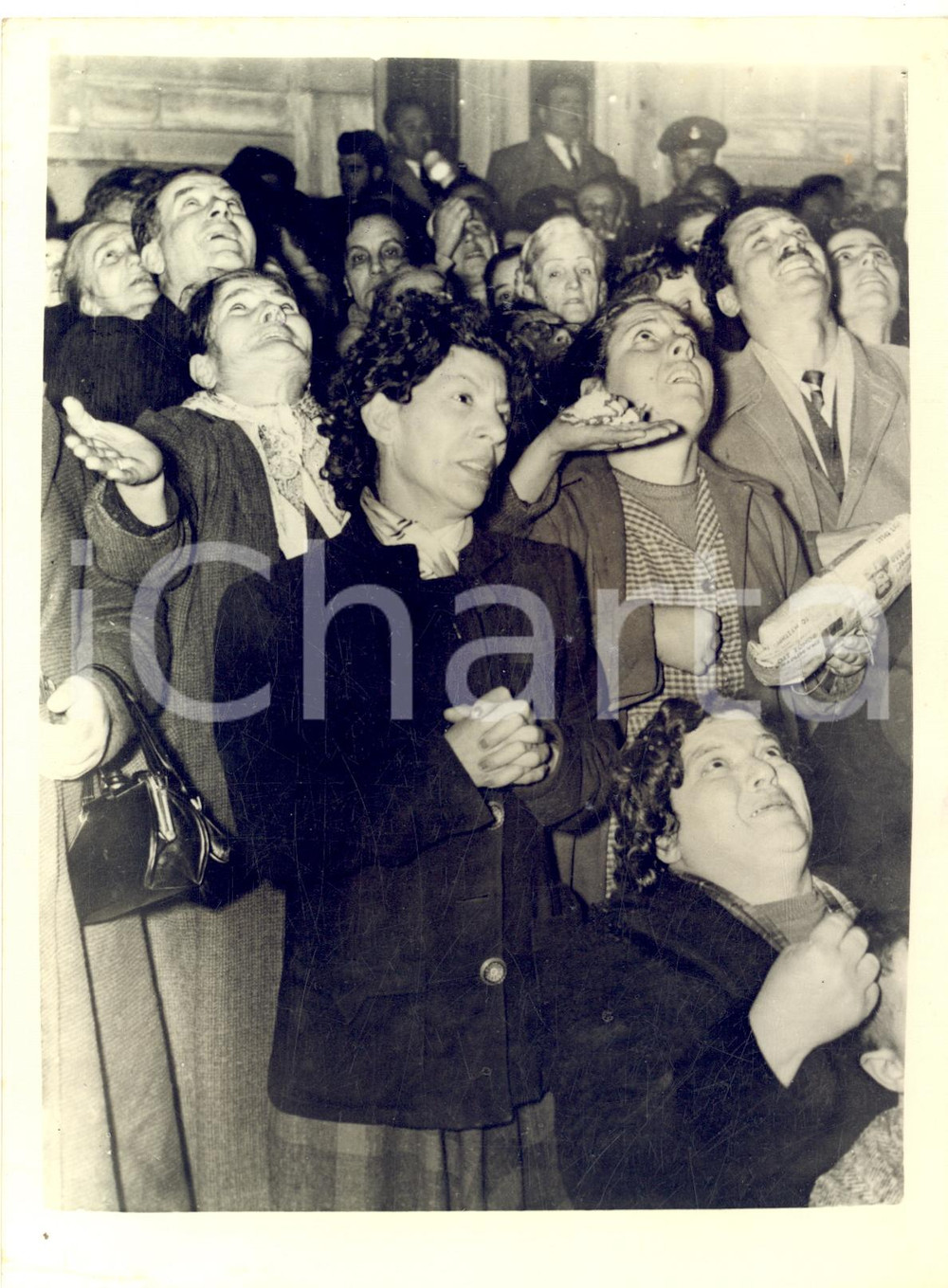 1957 ATHENS Crowd of sick people waiting beneath Mrs MAGOULA faith healer *Photo