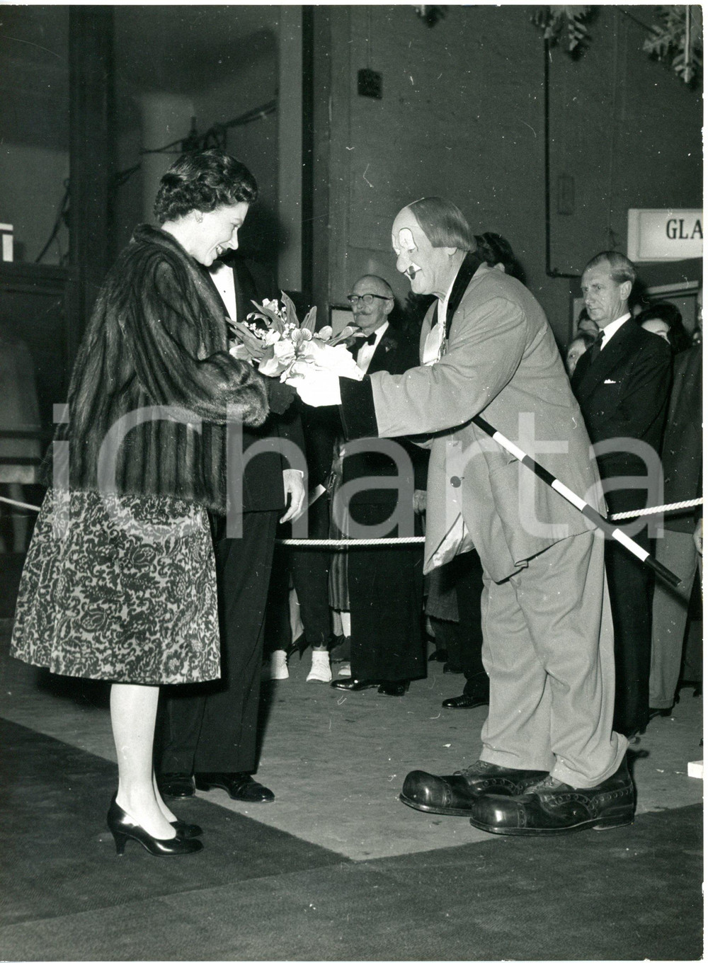 1960 LONDON Olympia - Queen ELIZABETH II receiving a bouquet from clown COCO