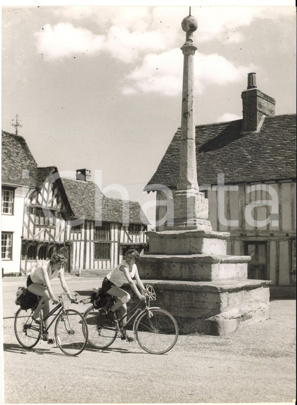 1958 LAVENHAM (SUFFOLK) Girls on bikes visiting the medieval village - Photo