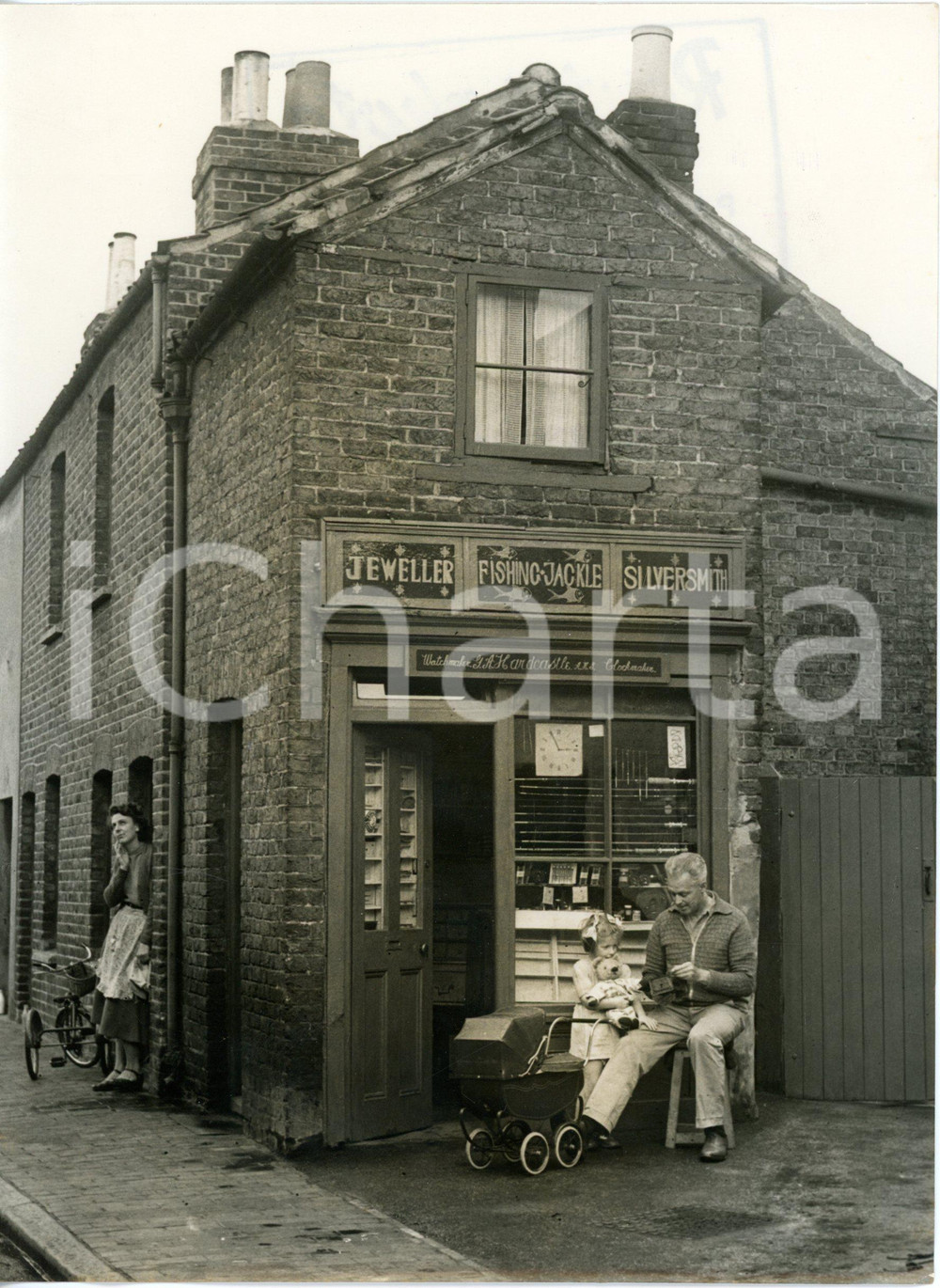 1953 BECKENHAM - G.A.HARDCASTLE sitting in front of his three-in-one shop *Photo