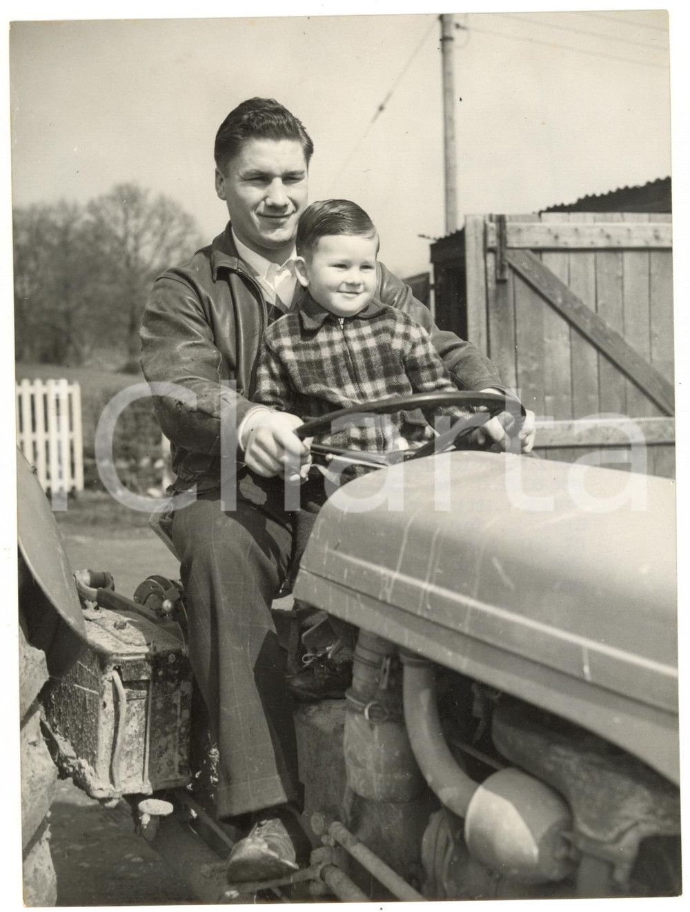 1954 HORAM (UK) Heavyweight champion Don COCKELL with his son driving a tractor