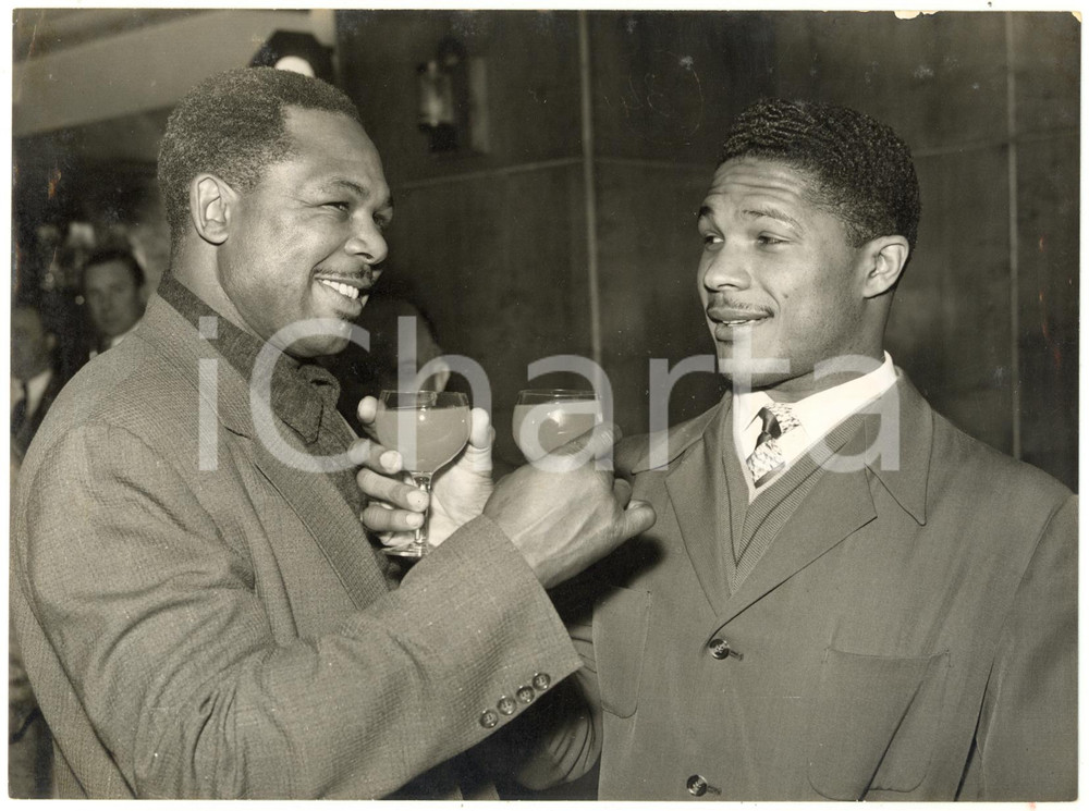 1956 LONDON Isow's Restaurant - Archie MOORE toasting with Yolande POMPEY