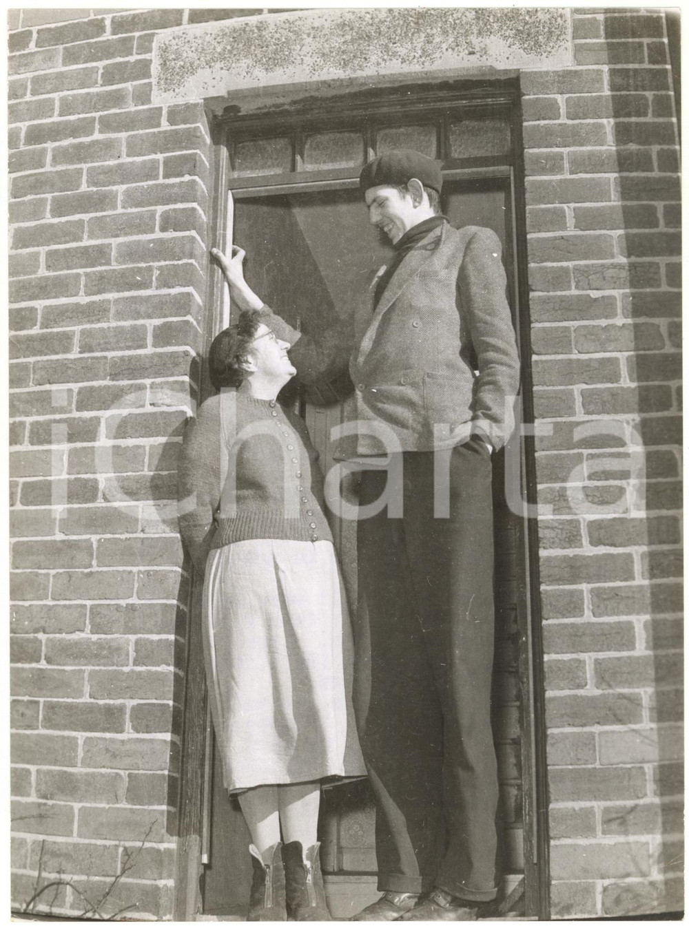 1960 HOYLAND (UK) - Britain's tallest schoolboy Frank EVE with his mother Verna