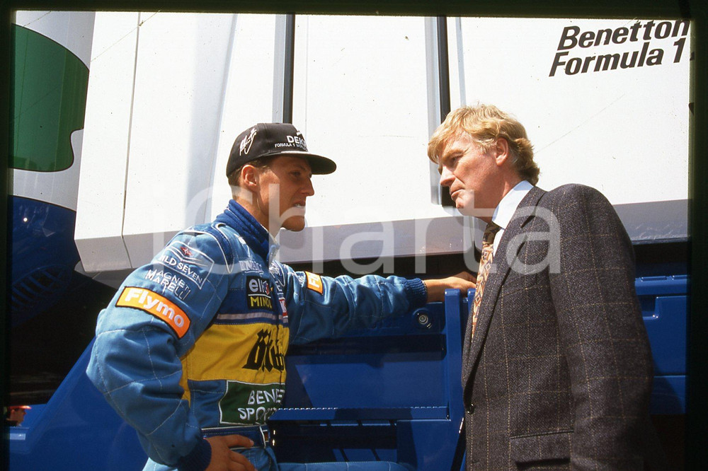 35mm vintage slide* 1990 ca FORMULA1 driver Michael SCHUMACHER, Max MOSLEY (186)  Diapositiva d'epoca, in formato 35 mm.CONDIZIONI: GOODE' severamente vietata la riproduzione. Tutti i diritti sono riservati.Nella diapositiva ICharta mette in vendita, sul negozio eBay e in esclusiva sul sito "icharta" il proprio archivio composto da numerose diapositive e negativi fotografici d'epoca, tutti originali e autentici, che attraversano la storia del costume italiano tra gli la fine degli anni Sessanta e Novanta.Si tratta di uno sguardo inedito sull'attualit&agrave;, la politica, la vita quotidiana, il gossip e la cultura, che fotografa il cambiamento della nazione in quest'ultimo scorcio del XX secolo. Un'occasione unica per il mercato del collezionismo, che vede finalmente disponibile un archivio eccezionale per vastit&agrave;, tematiche e condizioni, in un settore (il negativo fotografico e la diapositiva) di assoluta novit&agrave; e dalle interessanti prospettive di investimento.  FAIR/discreto   originale e autentica 1