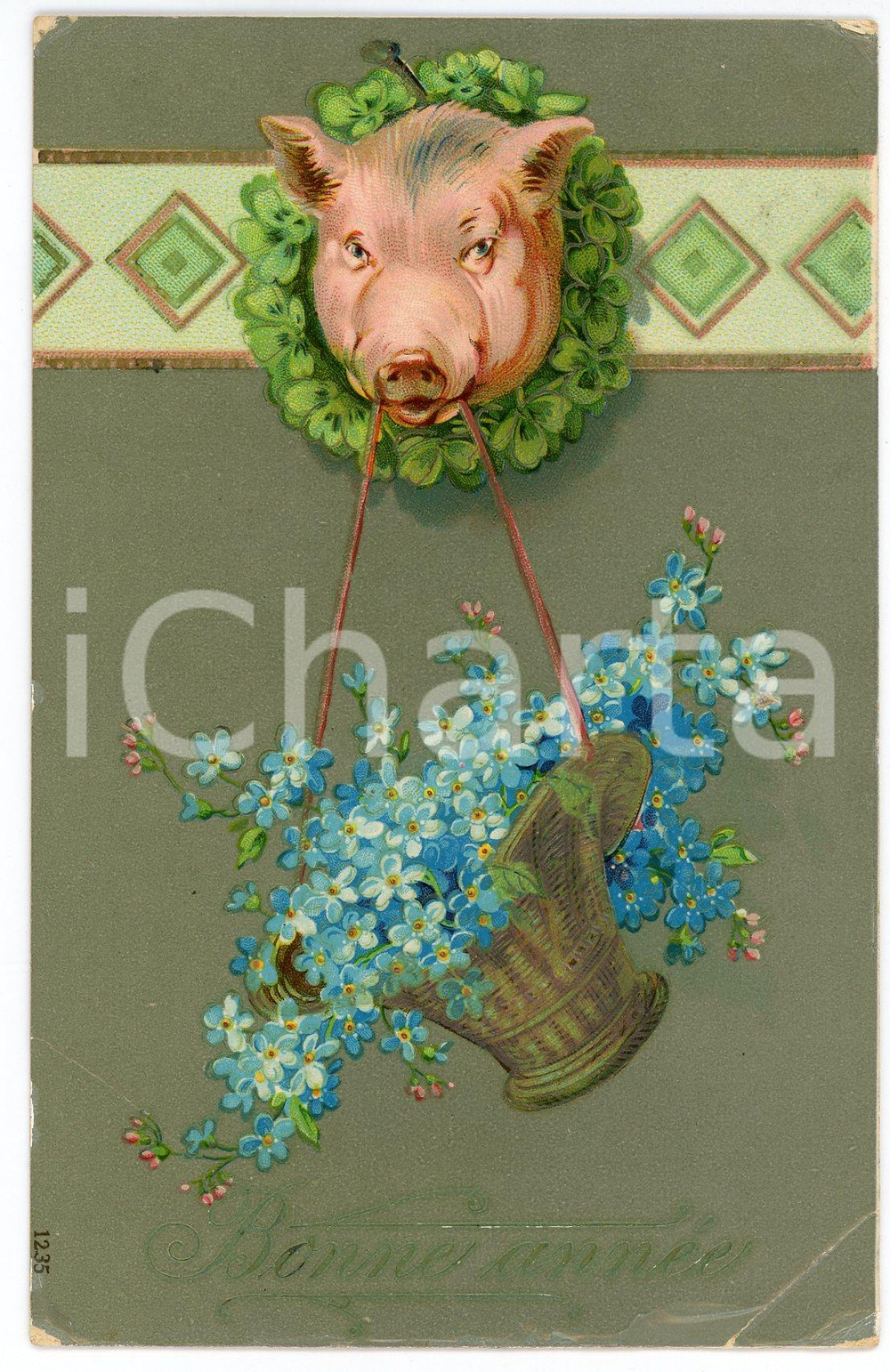 1909 BONNE ANNÉE Pig holding a basket of flowers - Embossed postcard  Cartolina postale d'epoca, viaggiata, in rilievo.CONDIZIONI: P (piegature evidenti agli angoli inferiori e parziale distacco della pellicola protettiva)FORMATO: FP    originale e autentica 1
