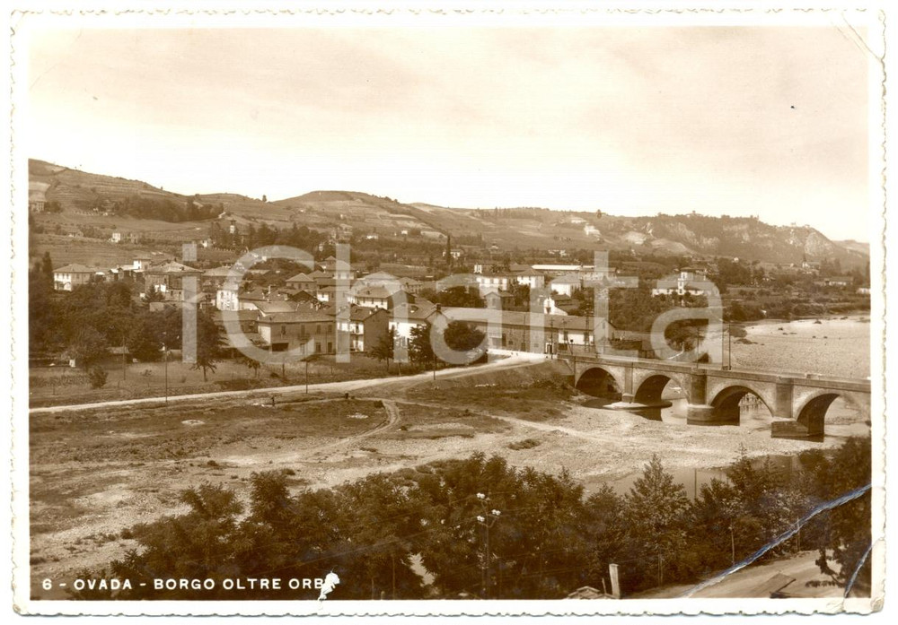 Cartolina originale da collezione 1950 ca OVADA AL Panorama con ponte sull ORBA Cartolina FG NV DANNEGGIATA 1