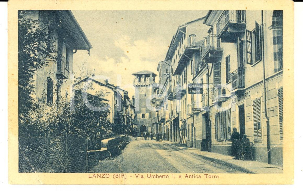 Cartolina originale da collezione 1930 LANZO TO Via Umberto I con torre e Albergo TORINO Cartolina DANNEGGIATA 1