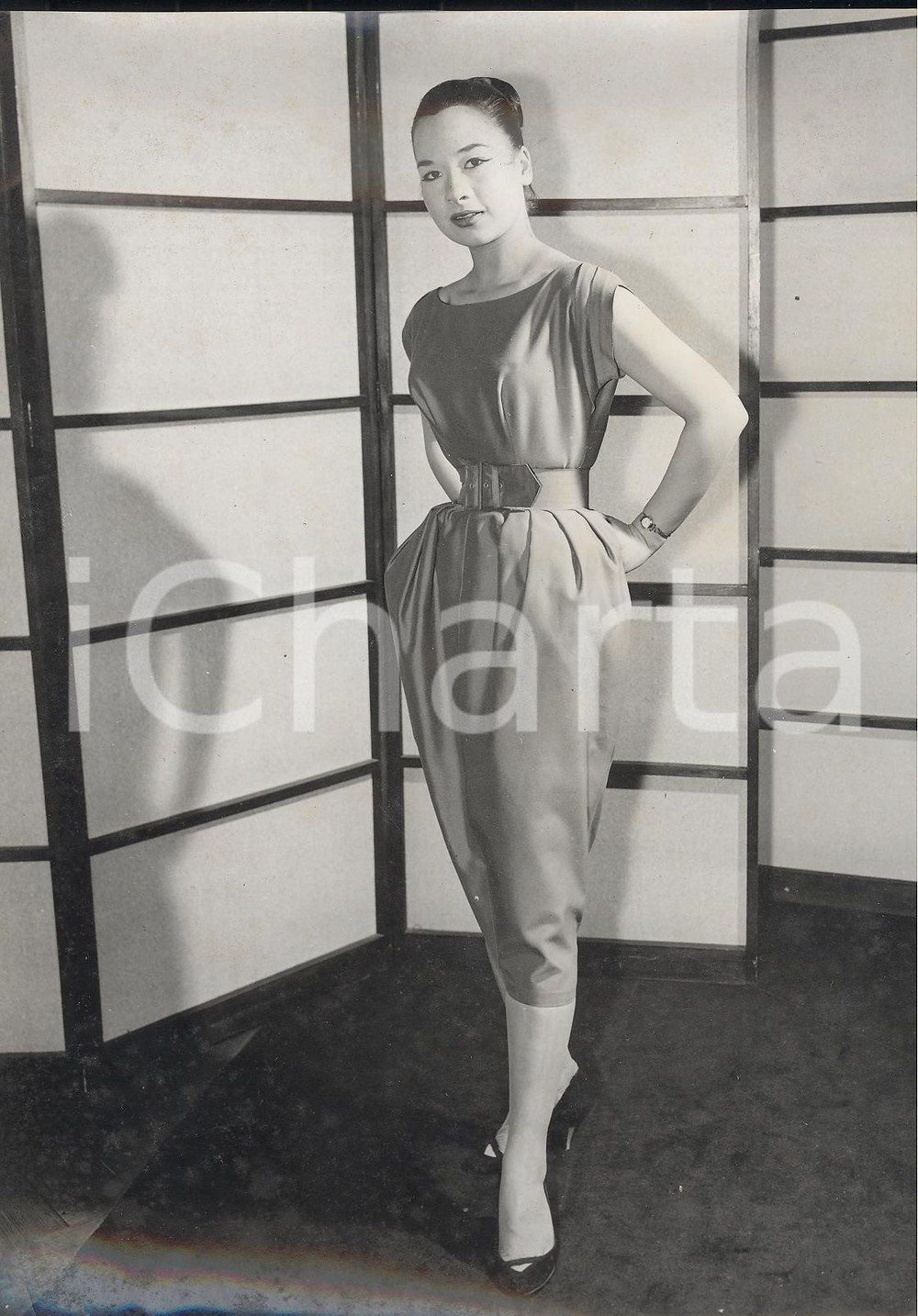 1957 LONDON Betty KAVANAGH showing new "peg top" cocktail dress by Linzi *Photo