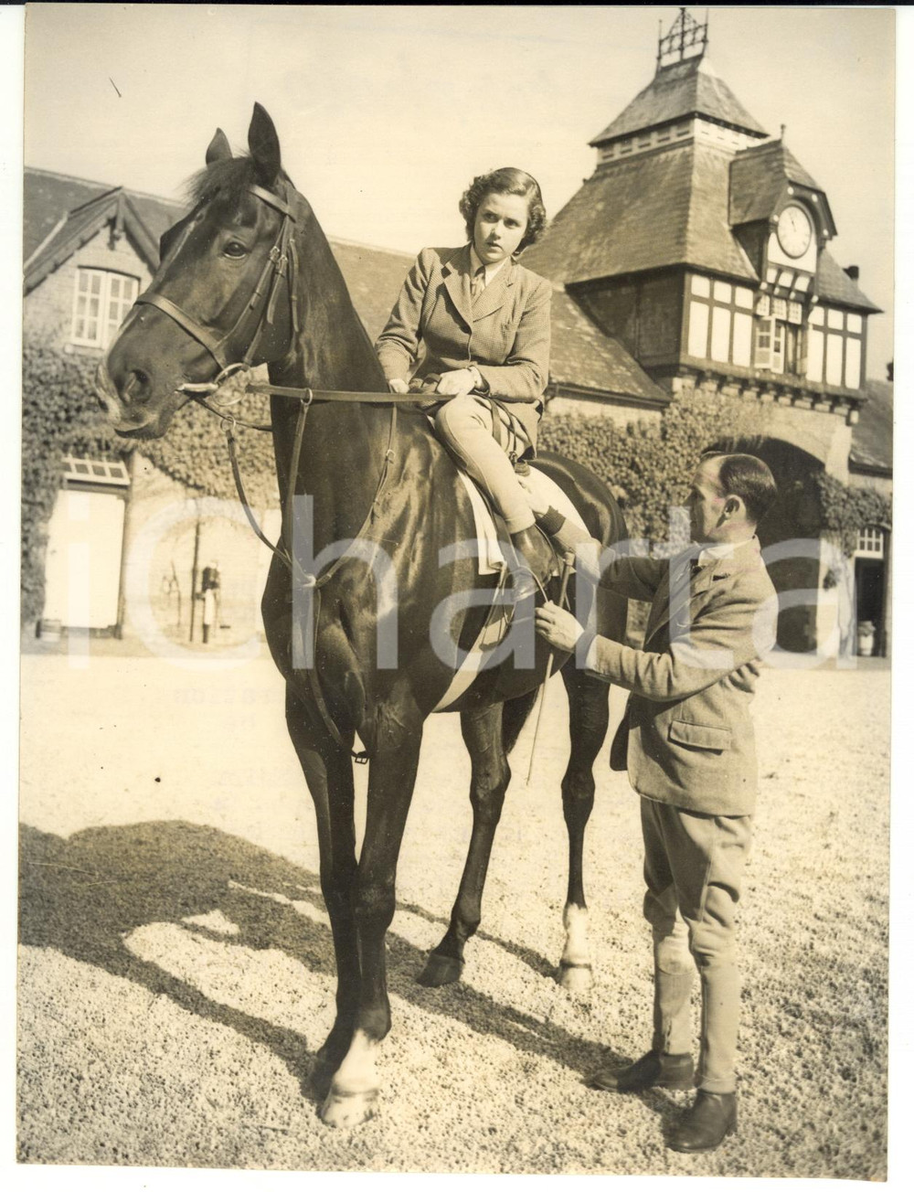 1953 MARLBOROUGH Cliff RICHARDS adjusting the stirrups of his daughter Betty