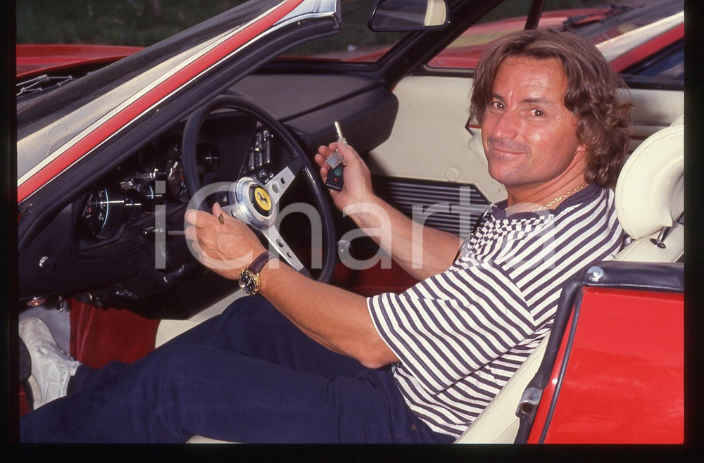 35mm vintage slide* 1990 ca COSTUME René ARNOUX al volante di una FERRARI