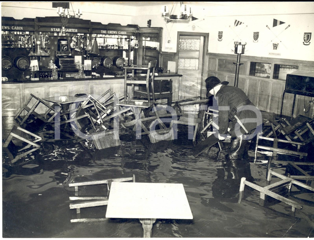 1957 LONDON Star and Garter Hotel - Firemen working in the flooded bar *Photo