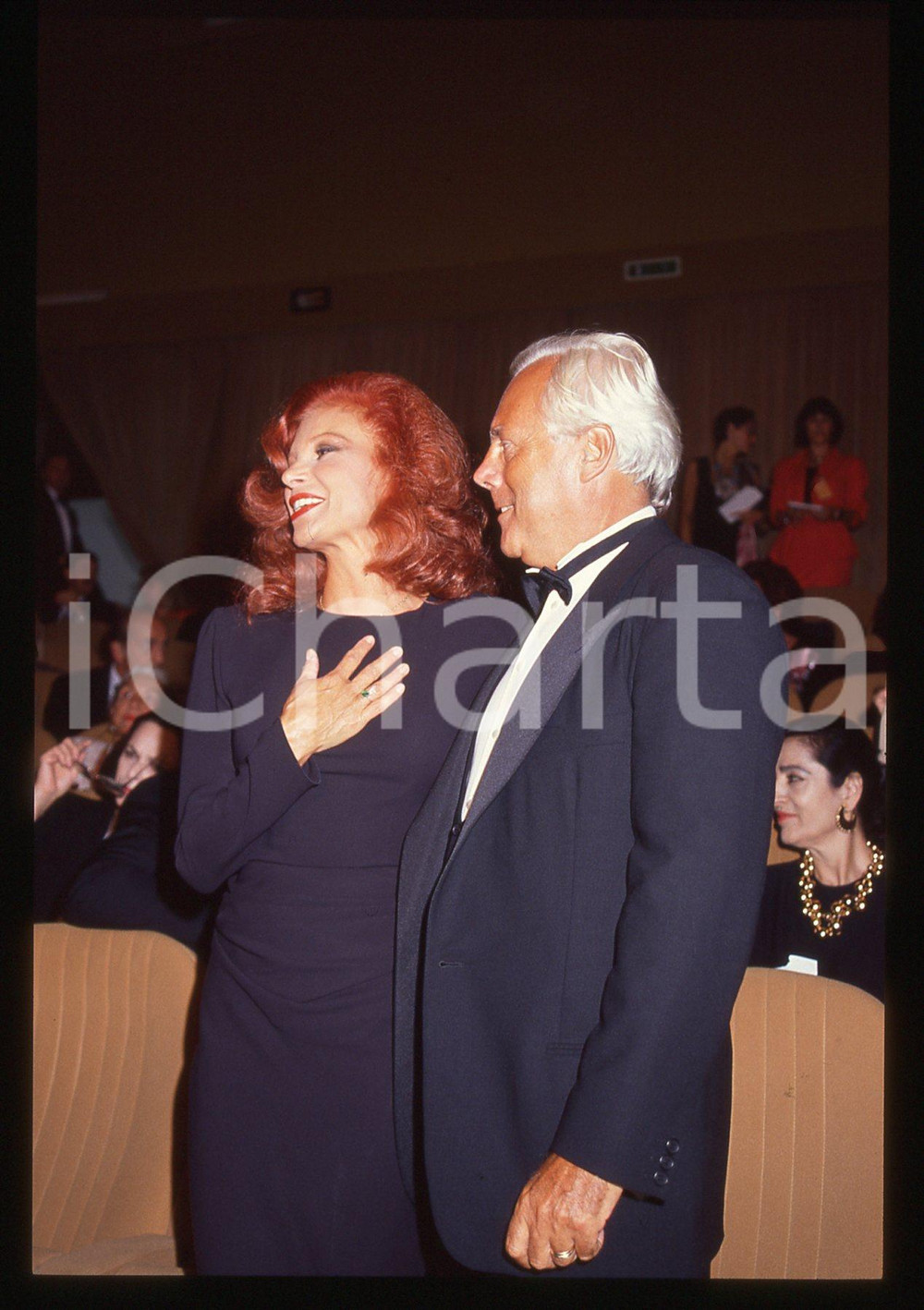 Giorgio ARMANI e MILVA - 1990 ca * 35 mm vintage slide 2  Diapositiva d'epoca, in formato 35 mm.Per i diritti rivolgersi a ICharta.E' severamente vietata la riproduzione. Tutti i diritti sono riservati.Nella diapositiva ICharta mette in vendita, sul negozio eBay e in esclusiva sul sito "icharta" il proprio archivio composto da numerose diapositive e negativi fotografici d'epoca, tutti originali e autentici, che attraversano la storia del costume italiano tra gli la fine degli anni Sessanta e Novanta.Si tratta di uno sguardo inedito sull'attualit&agrave;, la politica, la vita quotidiana, il gossip e la cultura, che fotografa il cambiamento della nazione in quest'ultimo scorcio del XX secolo. Un'occasione unica per il mercato del collezionismo, che vede finalmente disponibile un archivio eccezionale per vastit&agrave;, tematiche e condizioni, in un settore (il negativo fotografico e la diapositiva) di assoluta novit&agrave; e dalle interessanti prospettive di investimento.  GOOD/buono   originale e autentica 1
