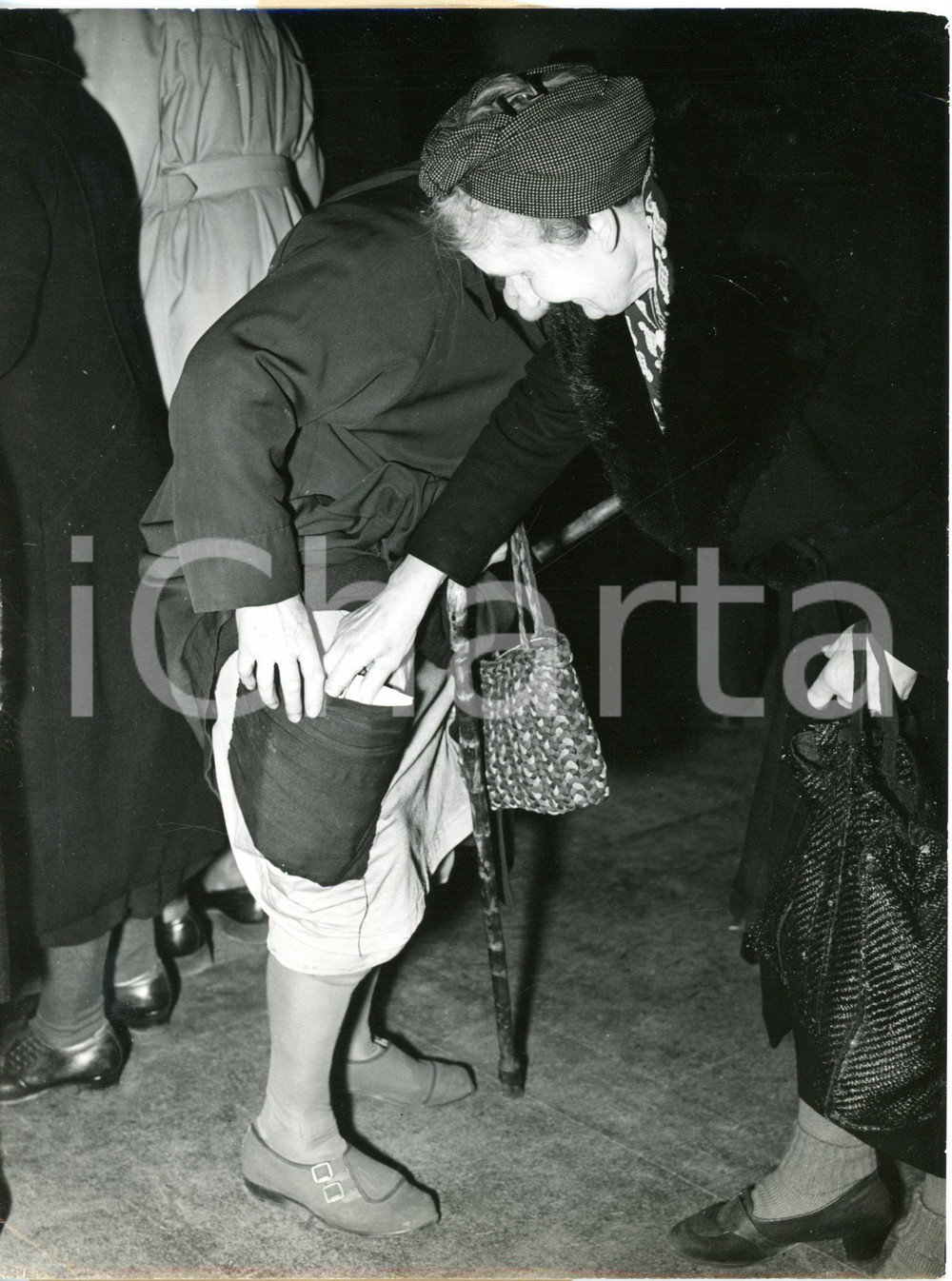 1953 EAST BERLIN - Woman hiding American butter in her petticoat to pass border