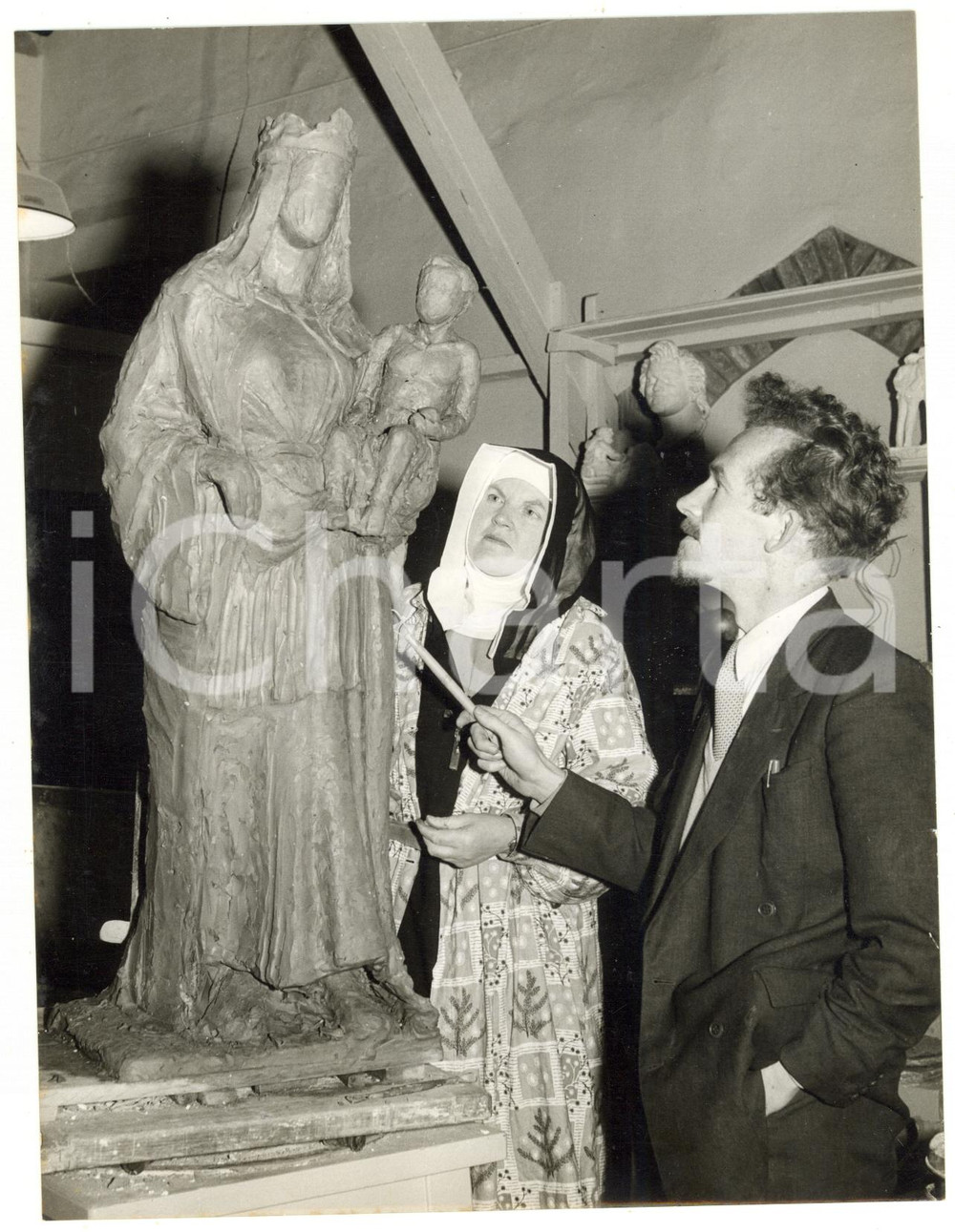 1957 NORWICH Sister Benedicta showing her sculpture in clay to John ROWBOTTOM