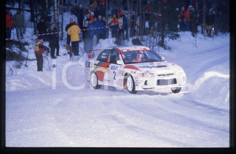 MITSUBISHI CARISMA GT EVO IV - WRC SWEDISH RALLY 1998 35 mm vintage slide 7 Diapositiva d'epoca, in formato 35 mm.CONDIZIONI: GOODE' severamente vietata la riproduzione. Tutti i diritti sono riservati.Nella diapositiva ICharta mette in vendita, sul negozio eBay e in esclusiva sul sito "icharta" il proprio archivio composto da numerose diapositive e negativi fotografici d'epoca, tutti originali e autentici, che attraversano la storia del costume italiano tra gli la fine degli anni Sessanta e Novanta.Si tratta di uno sguardo inedito sull'attualità , la politica, la vita quotidiana, il gossip e la cultura, che fotografa il cambiamento della nazione in quest'ultimo scorcio del XX secolo. Un'occasione unica per il mercato del collezionismo, che vede finalmente disponibile un archivio eccezionale per vastità , tematiche e condizioni, in un settore (il negativo fotografico e la diapositiva) di assoluta novità  e dalle interessanti prospettive di investimento.  GOOD/buono   originale e autentica 1