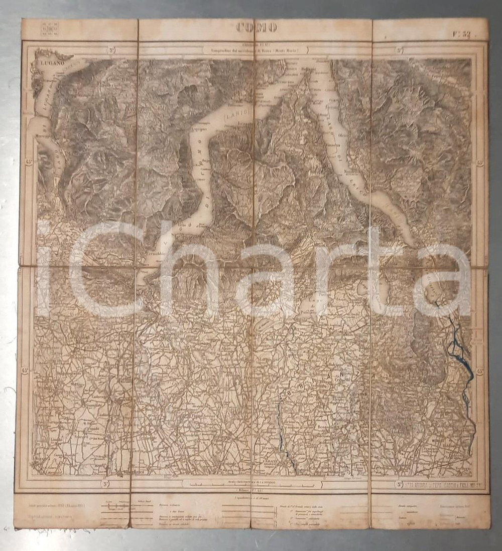 1895 COMO - Carta d'Italia Istituto Geografico Militare *Mappa su tela 42x45 Mappa pieghevole d'epoca, dell'Istituto Geografico Militare, montata su tela. Coloritura centrale.Timbro della "Ditta Artaria di Ferd. Sacchi e Figli". CONDIZIONI:FAIR/discreto fioriture al lato inferioreFORMATO: 42x45 cm originale e autentica 1