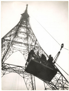 1957 LONDON Men in a cradle ascending the BBC transmitting tower to fix rockets