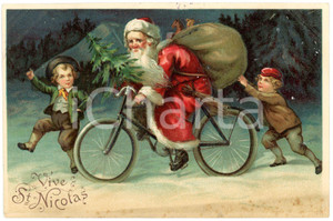 1919 CHRISTMAS Vive St. Nicolas - Santa Claus on a bike - Embossed postcard  Cartolina postale d'epoca, viaggiata, in rilievo.CONDIZIONI: F (fioriture al lato inferiore)FORMATO: FP    originale e autentica 1