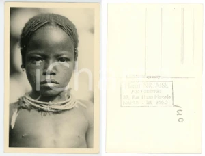 1930 ca C. ZAGOURSKI «L'Afrique qui disparaît» CONGO BELGE Enfant MBOUAKA *n. 49  Fotocartolina postale d'epoca, appartenente alla 2^serie &laquo;L'Afrique qui dispara&icirc;t&raquo; del fotografo Casimir Zagourski (L&eacute;opoldville).N&deg; 49, non viaggiata.Timbro ulteriore al verso del fotografo Henri Nicaise - Namur. GOOD/buono  Formato: 9x14 cm originale e autentica 1
