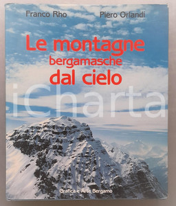 1987 Franco RHO Piero ORLANDI Le montagne bergamasche dal cielo 163 pp. Brossura editoriale, con copertina telata rigida e sovraccoperta illustrata.PAGINE: 163EDITORE: Grafica e arte Bergamo GOOD/buono ma tracce d'uso alla sovraccoperta e fioriture ai fogli di guardia Formato: 25x31 cm originale e autentica 1