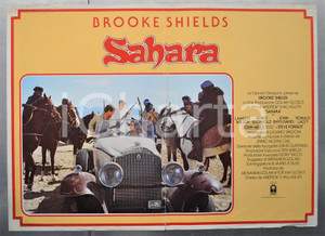 Materiale cinematografico d’epoca 1983 SAHARA Brooke SHIELDS Lambert WILSON Horst BUCHHOLZ Fotobusta 66x46 cm 1