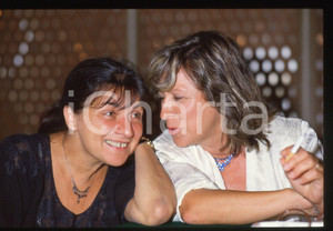 35mm vintage slide* 1995ca Márta Mészáros and Margarethe von Trotta (2)   Diapositiva d'epoca, in formato 35 mm. CONDIZIONI: GOODTutti i diritti riservati.E' severamente vietata la riproduzione. ICharta mette in vendita, sul negozio eBay e in esclusiva sul sito "icharta" il proprio archivio composto da numerose diapositive e negativi fotografici d'epoca, tutti originali e autentici, che attraversano la storia del costume italiano tra gli la fine degli anni Sessanta e Novanta.Si tratta di uno sguardo inedito sull'attualit&agrave;, la politica, la vita quotidiana, il gossip e la cultura, che fotografa il cambiamento della nazione in quest'ultimo scorcio del XX secolo. Un'occasione unica per il mercato del collezionismo, che vede finalmente disponibile un archivio eccezionale per vastit&agrave;, tematiche e condizioni, in un settore (il negativo fotografico e la diapositiva) di assoluta novit&agrave; e dalle interessanti prospettive di investimento.  originale e autentica 1