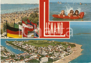 Cartolina originale da collezione 1972 LIGNANO SABBIADORO (UD) Bambini su materassino vedutine *Cartolina FG VG 1