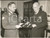 1958 LONDON Lt-General E.L.M. BURNS shows to Earl HOWE the United Nation medal