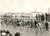 1955 CICLISMO MILANO-SANREMO - PAVIA - Corridori al Ponte sul Ticino *Foto 18x13 Fotografia d'epoca con didascalia coeva. CONDIZIONI: FAIR (sovraimpressione circolare)    originale e autentica 1