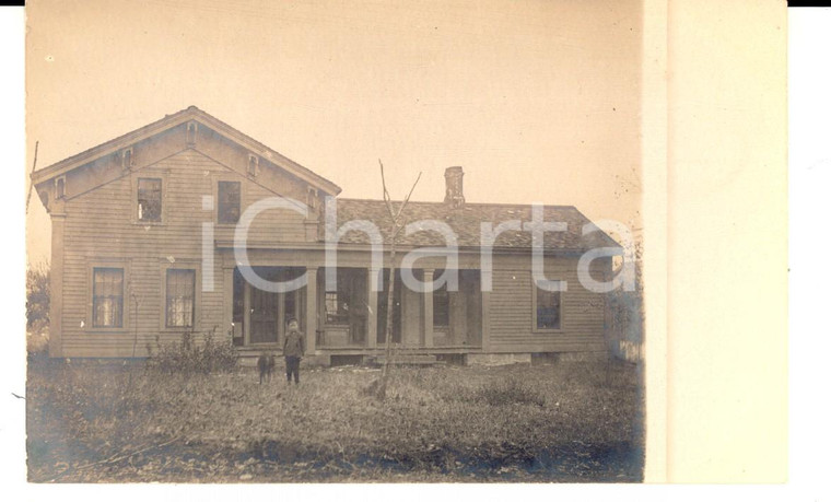 1910 ca USA A child with a dog in front of his home *Real photo postcard RPPC