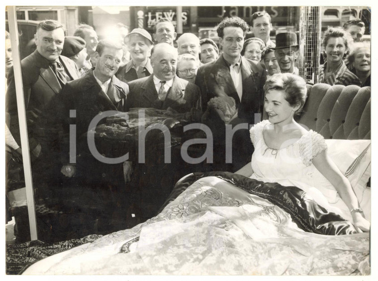 1957 LONDON High Street - Annette GIBSON demonstrating the comfort of a bed