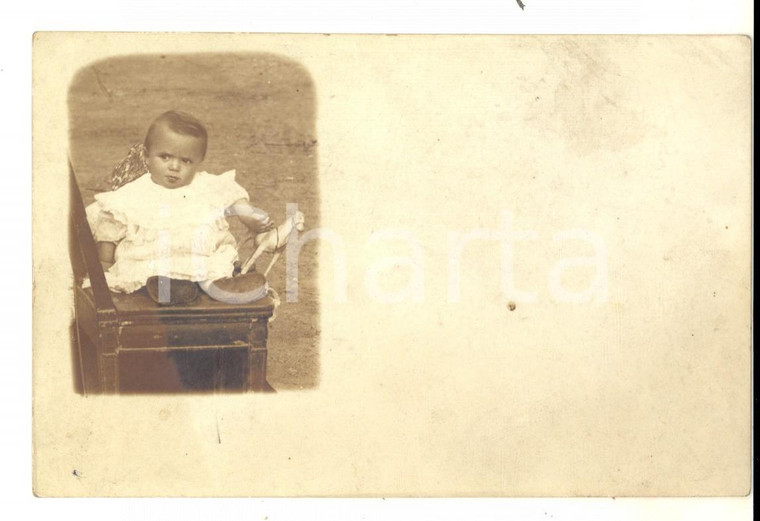 1920 ca MILANO (?) Ritratto di bambino con un giocattolo *Foto cartolina