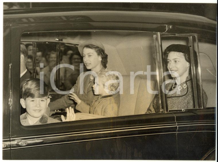 1953 LONDON Prince Charles with ELIZABETH II greets the crowd from the Royal Car