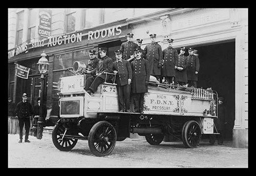 New York City Firemen posed on a Fire Engine