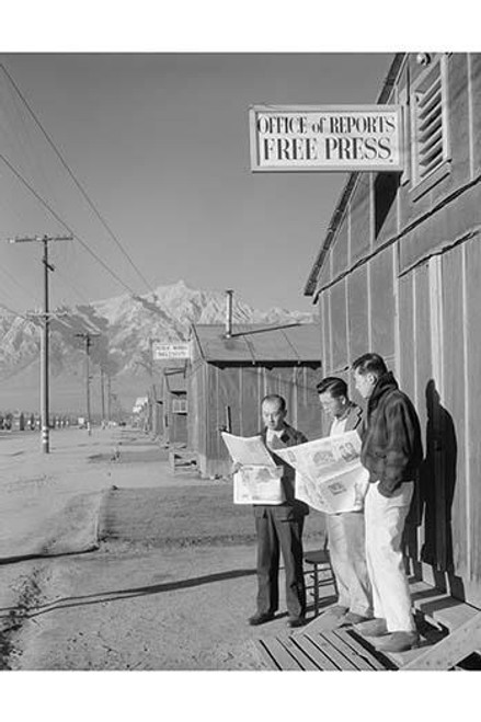 Roy Takeno and a group reading the Manzanar paper