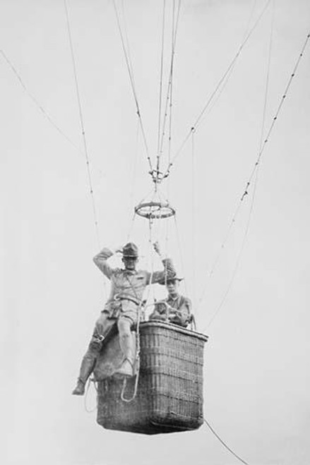 Balloon jump by a parachutist hanging from a basket suspended by it but out of the image.