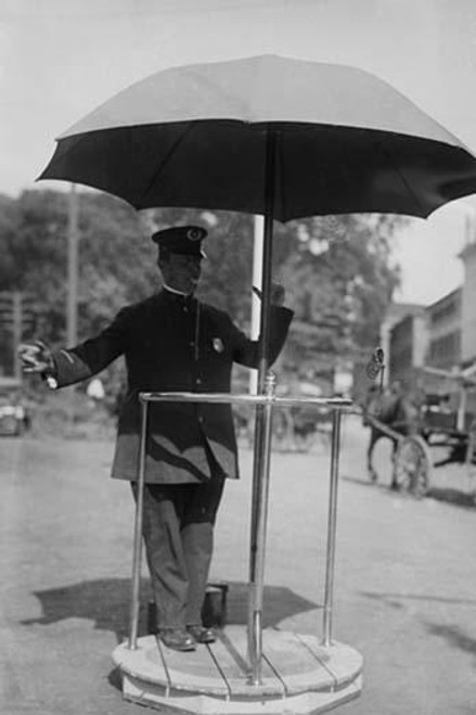 Policeman Directs traffic from underneath an umbrella in Newport, Rhode Island